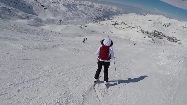 Old Woman Skier Skiing Down With Difficulty On Slope Of The Mountain In Winter