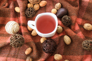 Autumn decor with white cup of tea.