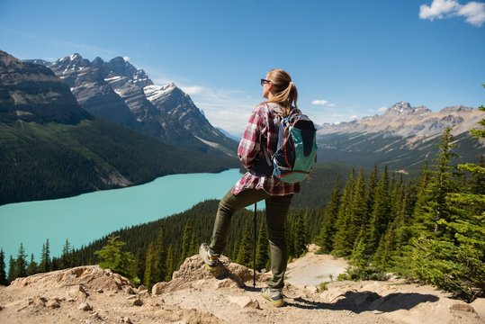 Female Hiker Standing With Backpack At Countryside