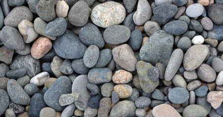 Beach stones background. Top view.