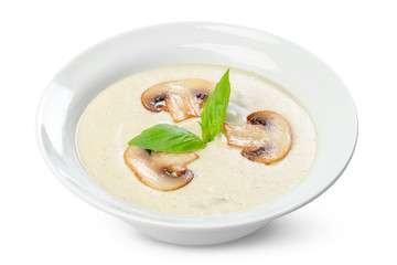 cream soup in white bowl isolated
