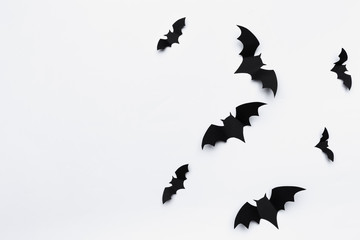 halloween and decoration concept - paper bats flying