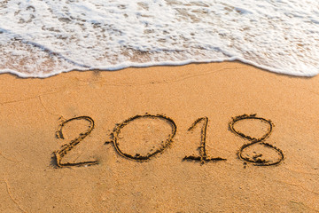 2018 on a beach sand