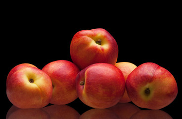 group of juicy peaches lying isolated
