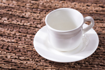 Empty coffee cup. Wooden background