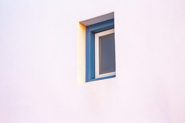 Wooden window in a white wall . Minimalist.