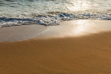 Wave of the sea on the sandy beach