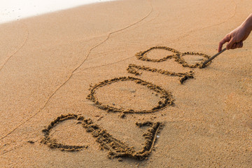 Write 2018  on a beach sand