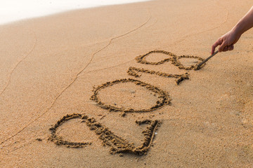 Write 2018  on a beach sand