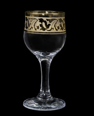 Wineglass on a black background.