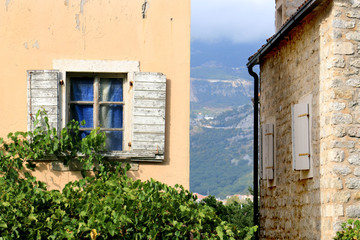 Budva old town. Historic streets, old houses and St. John's Church square. Montenegro, 2018.