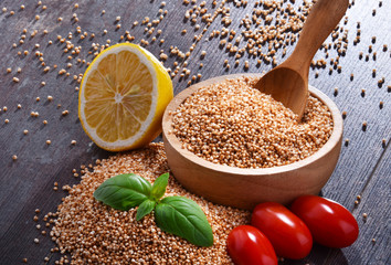 Bowl of amaranth grain on wooden table