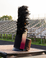 customized shako with plume resting on a drum majors stand during a break in rehearsal