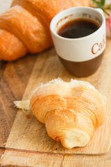 Flat lay composition with coffee and croissants.