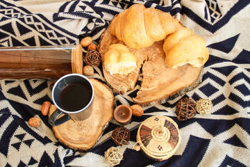 Flat lay composition with cup of coffee and croissants.