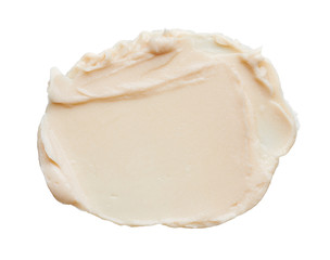 Light beige makeup smear of creamy foundation