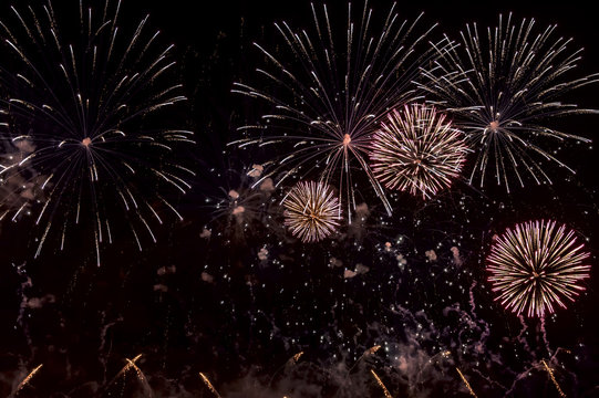 Red Fireworks on black background for cut out. For celebration design. Abstract holiday firework display background.
