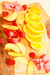 Composition of nectarine orange raspberry cocktails with watermelon