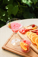 Composition of nectarine orange raspberry cocktails with watermelon
