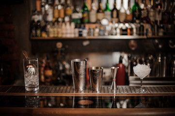 Set of necesary barman equipment on the bar counter