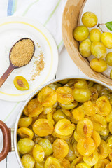 Sliced plums in a pot prepared for cooking jam