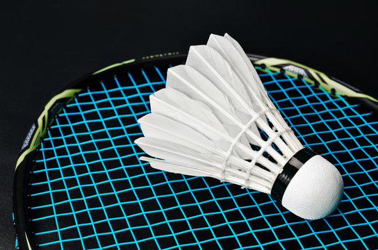 shuttlecock and badminton racket .