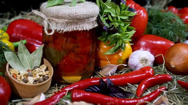 Marinated sweet pepper in a glass jar. Vegetable set of pepper and tomato
