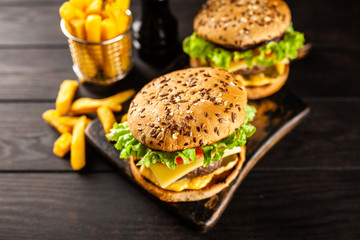 Delicious grilled burgers © George Dolgikh