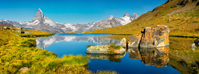 Picturesque summer panorama of the Stellisee lake.