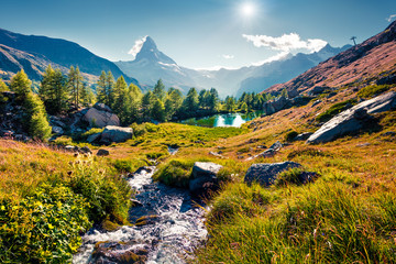 Colorful summer sunrise on the Grindjisee lake