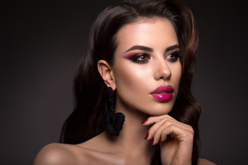 Beautiful woman with professional make up and hairstyle.