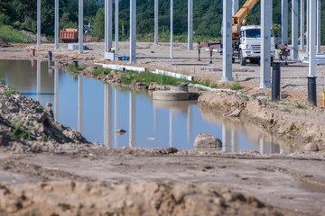 Industrial construction site of new commercial shopping mall. Reinforced concrete piles foundation...