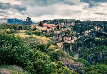 Obraz premium Dramatic spring scene in Meteora, UNESCO World Heritage site. Splendid morning view of Eastern Orthodox monasteries, built on top of rock pillars. Kalambaka village location, Greece, Europe.