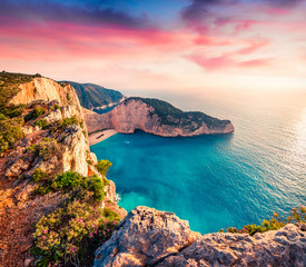 Dramatic spring scene on the Shipwreck Beach. Colorful sunset on the Ionian Sea, Zakinthos island,...