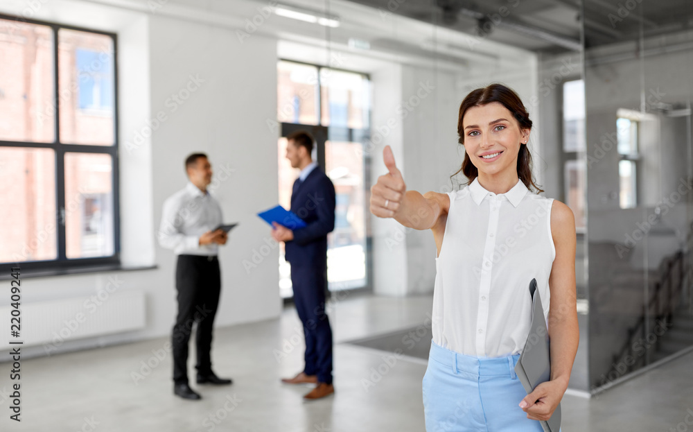 Sticker real estate business, sale and people concept - happy smiling realtor or businesswoman with folder showing thumbs up and customers at new office room