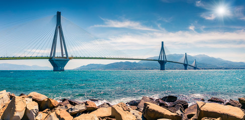 Sunny morning panorama of Rion-Antirion Bridge. Colorful spring view of the Gulf of Corinth,...