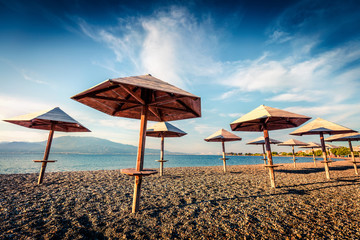 First warm days on the Nafpaktos beach. Sunny spring seascape of Corinth Gulf. Splendid morning...