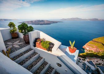 Sunny morning view of Santorini island. Picturesque spring scene of the  famous Greek resort Thira, Greece, Europe. Traveling concept background. Artistic style post processed photo.