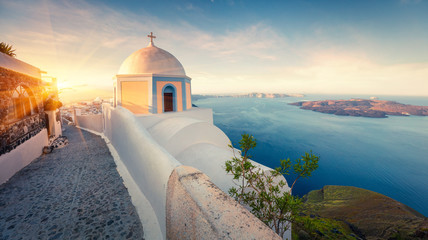 Sunny morning panorama of Santorini island. Picturesque spring sunrise on the famous Greek resort...