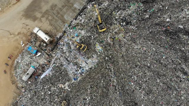 Large garbage pile, degraded garbage. Pile of stink and toxic residue / Garbage pile in trash dump or landfill - Recycling industry, Bird's-eye view from drone
