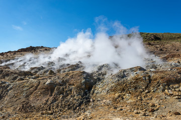 Seltún, high temperature geothermal area, boardwalk through area, mudpots, fumaroles, minerals deposited, colorful sediments, Seltun South West Iceland near Reykjavik