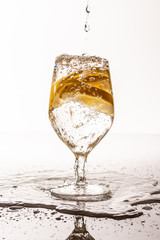 Glass with water and lemons