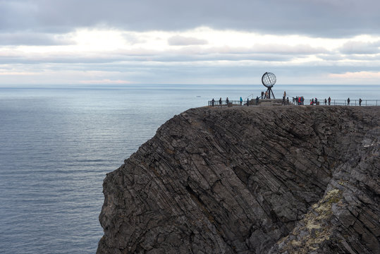 norwegian north cape monument, with people tourists making pictures, norway, europe