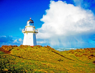 Waipapa Point Lighthouse in the Catlins National Park in New Zealand. Taken on a sunny winter day,...