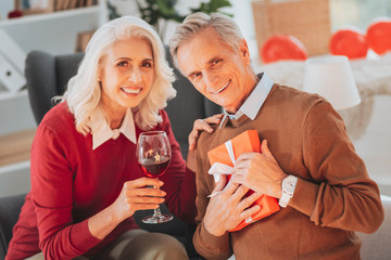 Mature family. Happy people expressing positivity while looking straight at camera
