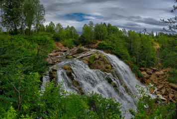 Fototapeta na wymiar Russia. Altai territory. Waterfall on the river Pescherka