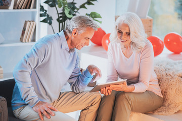 Obraz premium Need your advice. Attentive man bowing head while watching video