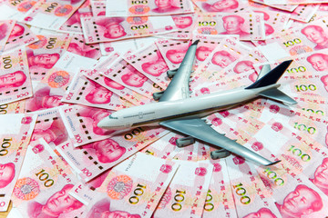 Fototapeta na wymiar Yuan or RMB, Chinese Currency and airplane