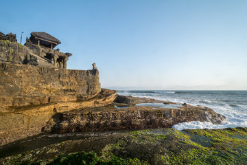 sunset an temple pura tanah lot at bali indonesia while ebb