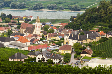 Spitz, Austria, View to tonw and old church from green vineyards.